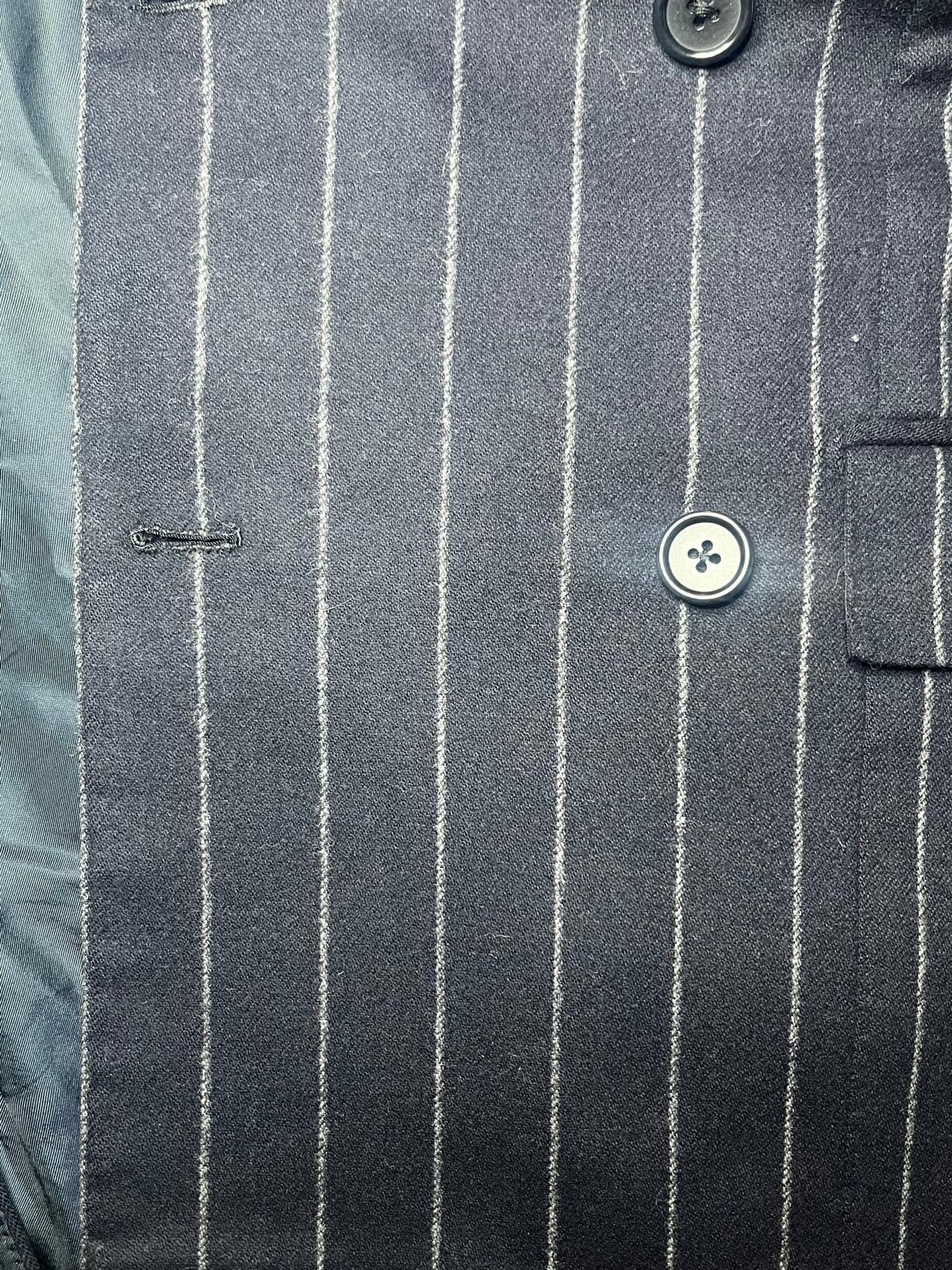 Dopo — Giacca blu gessata ripristinata